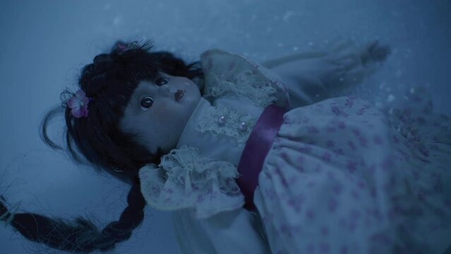 Scary old porcelain doll sinking.