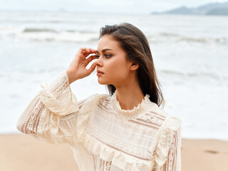 Beauty in the Summer Breeze: A Young and Elegant Female Model Embracing Nature's Charms on the Beach