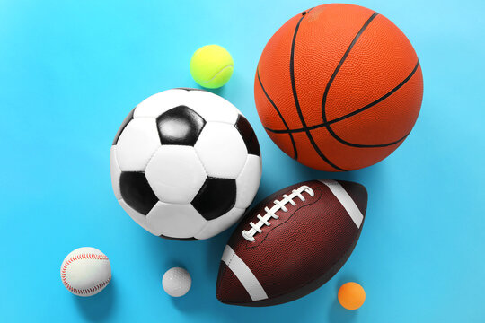 Many different sports balls on light blue background, flat lay © New Africa