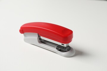 One stapler on white table. Office stationery