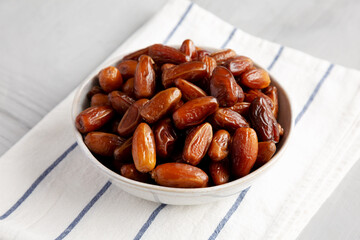 Organic Raw Date Fruit in a Bowl, side view.