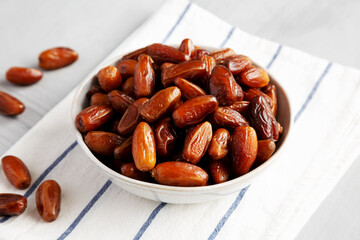 Organic Raw Date Fruit in a Bowl, side view.