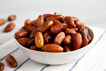Organic Raw Date Fruit in a Bowl, side view. Close-up.