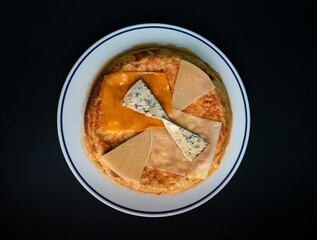 Omelette covered with 4 varieties of cheese