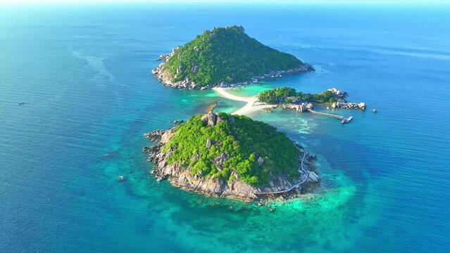 Koh Nangyuan charms with its stunning vistas, vibrant marine life, and picture-perfect scenery. Drone aerial view. Sea stock footage. Ko Tao, Surat Thani Province, Southern Thailand. 4K HDR. 
