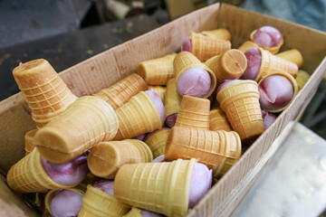 Ice cream in the waffle cup in the box.