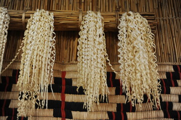 Inau or inaw a wooden ritual wood-shaving stick used by Ainu people for prayers to kamuy gods in...