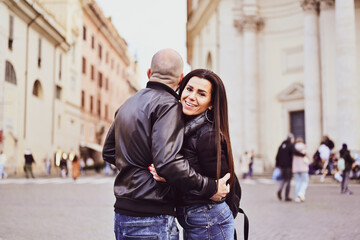 Fototapeta na wymiar Happy Beautiful Tourists couple traveling at Rome, Italy, taking a selfie portrait at Piazza del Popolo.Visiting Italy - man and woman enjoying weekend vacation - Happy lifestyle concept 