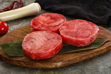 Delicous raw tuna medallion for cooking