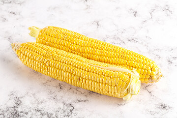 Sweet yellow raw corn cob
