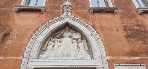 Venice with a facade decoration depicting the saint
