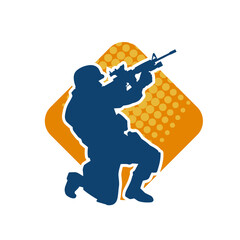 Silhouette of a male soldier carrying machine gun weapon.