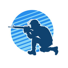 Silhouette of a male soldier carrying machine gun weapon.