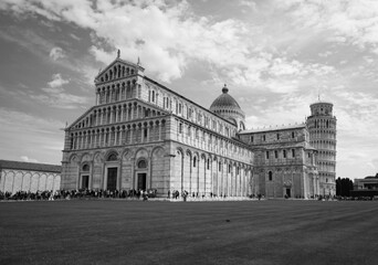 Iconic Piazza del Duomo with cathedral and leaning tower in Pisa, Italy