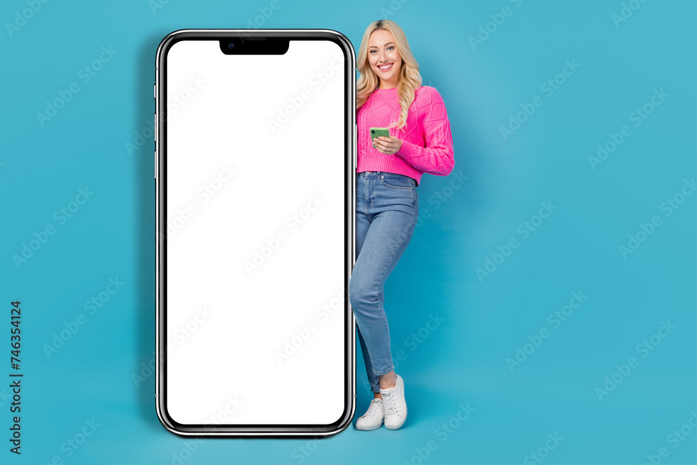 Sticker full body length photo of smiling joyful young lady blonde hair near smartphone display browsing web