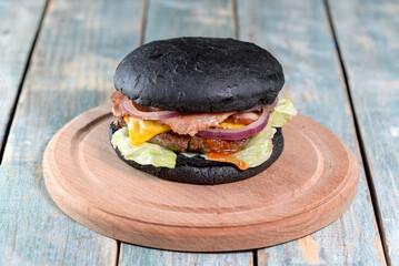 burger on a wooden board