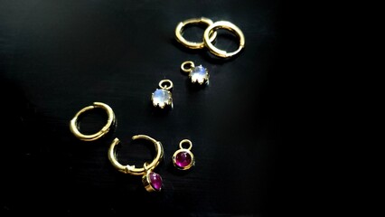 earring 18k Gold setting with gems stone on black background. Jewelry set for strore - obrazy, fototapety, plakaty