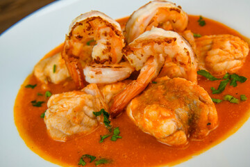 Recipe for Armorican-style monkfish tail, prawns, flambees with cognac, High quality photo