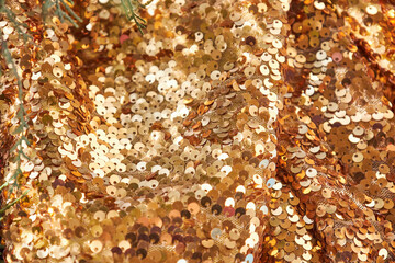 Waves of brightly shiny fabric with large gold sequins. Festive rich textiles glitter mesh for...