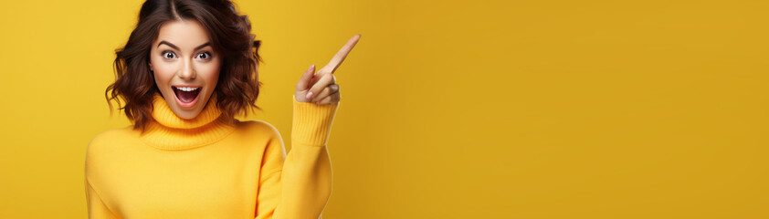 Surprised, shocking, excited young woman with her mouth open on a yellow background. ?opy space for text.Banner - obrazy, fototapety, plakaty