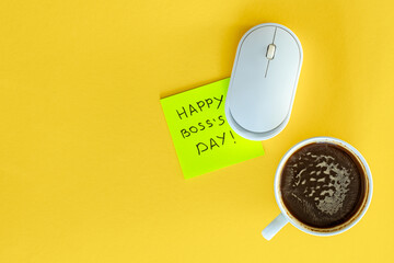 A cup of coffee, a computer mouse and the inscription Happy Boss Day.