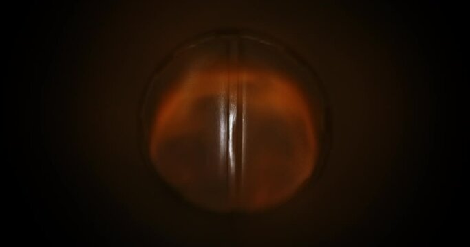 continuous flow of fire forms vortex inside metal machine pipe