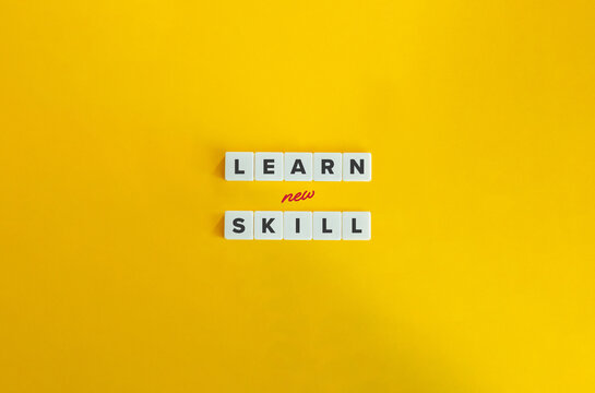 Learn New Skill Phrase. Concept of Upskilling, Reskilling, Acquiring Knowledge, Ability, or Technique, Developing Proficiency. Text on Block Letter Tiles on Yellow Background.