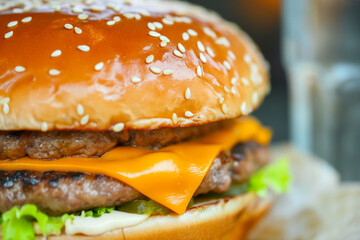 Double cheeseburger with fresh toppings. Close-up