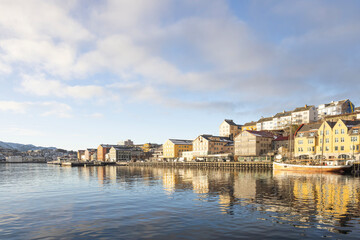 Walking along the seaside in Kristiansud city on great winter day