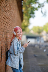 Woman using smartphone on the street.