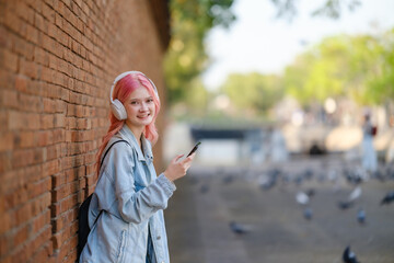 Woman using smartphone on the street.