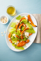 Healthy salad with roasted pumpkin and almond