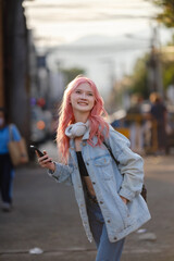 Fototapeta premium Woman using smartphone on the street.