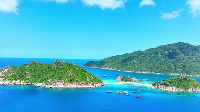 Koh Nangyuan boasts pristine beaches, clear waters, and stunning coral reefs, perfect for diving and relaxation. Top view Aerial view of drone. Sea stock footage. Koh Nangyuan, Thailand. 4K HDR.
