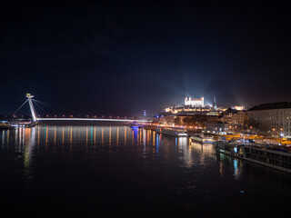 Night view of Bratislava where you can see the Danube, the bridge of the Slovak National Uprising, the luxury UFO restaurant and Bratislava Castle.