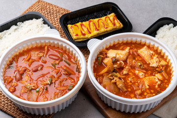 Korean food, kimchi stew, ham, soft tofu, pork, egg roll, rice, side dishes