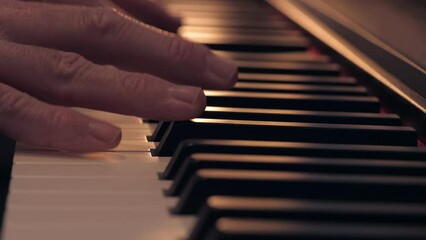 Harmony in Motion: Close-Up of Pianist's Hands Playing with Elegant Backlit Silhouette