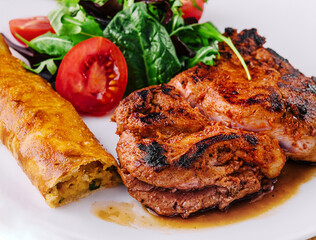 Tasty grilled beef steak with salad