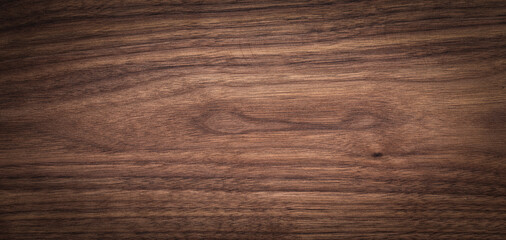 Walnut wood texture background. Wide format black walnut natural texture desktop background.	