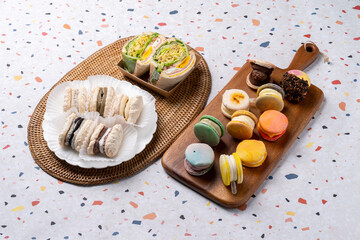 Macaron, cranbrae, pork bar, blueberry, cheese, yogurt, dacquoise, injeolmi, rice cake, matcha, chocolate, Oreo, hazelnut, black sesame, ham, sandwich,