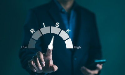 Risk management concept. Businessman touching risk level indicator virtual rating low to high for...