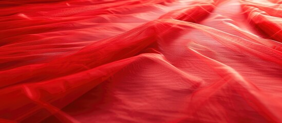A bed is fully covered in red sheets and sheets, creating a bold and vibrant look. The red tulle background adds texture, while a funky spotlight shines on the red carpet.
