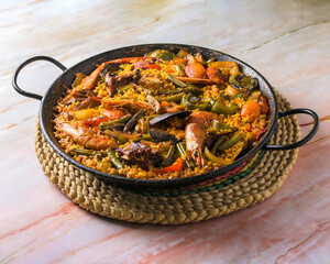 isolated view of paella mixta, typical spanish food,mediterranean gastronomic culture