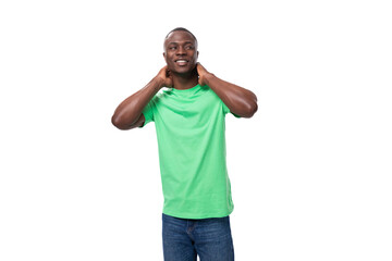 a handsome 30 year old african man dressed in a light green basic t-shirt has a strategy