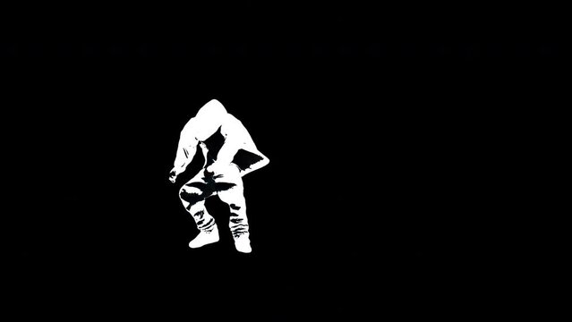 black and white silhouette of breakdancer dancing 