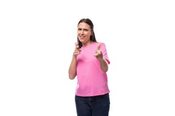 young stylish brunette lady dressed in a pink t-shirt feels optimistic