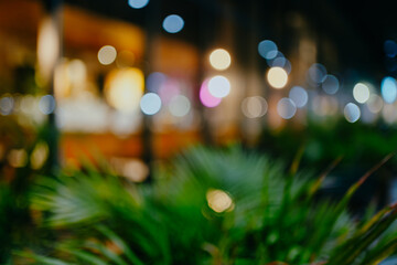 Abstract blur image of coffee shop or restaurant on night time with bokeh for background usage.