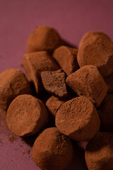 truffle candies piled on a purple background