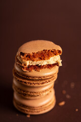 pieces of brown coffee macaron on a brown background