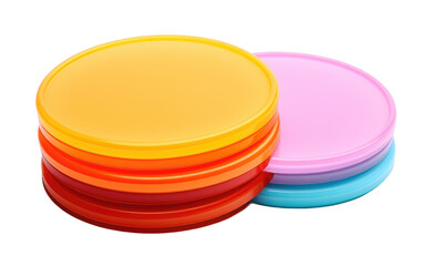 A collection of vibrant frisbees in various colors stacked neatly on top of each other. The frisbees look playful and ready for outdoor fun. on a White or Clear Surface PNG Transparent Background.